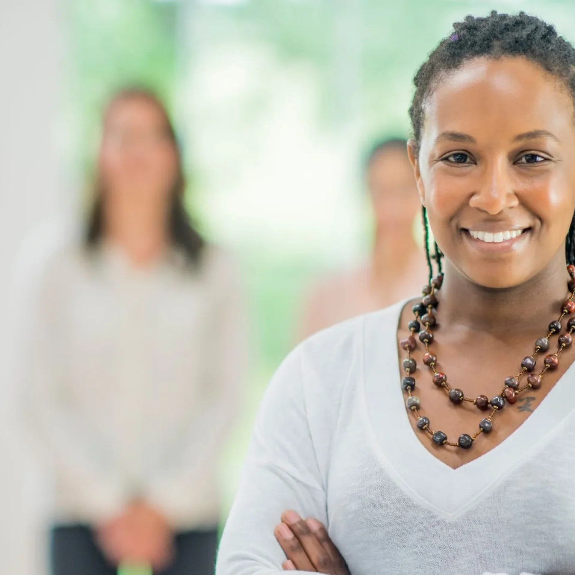 Faith and leadership concept showing a confident woman leader standing in front of a team