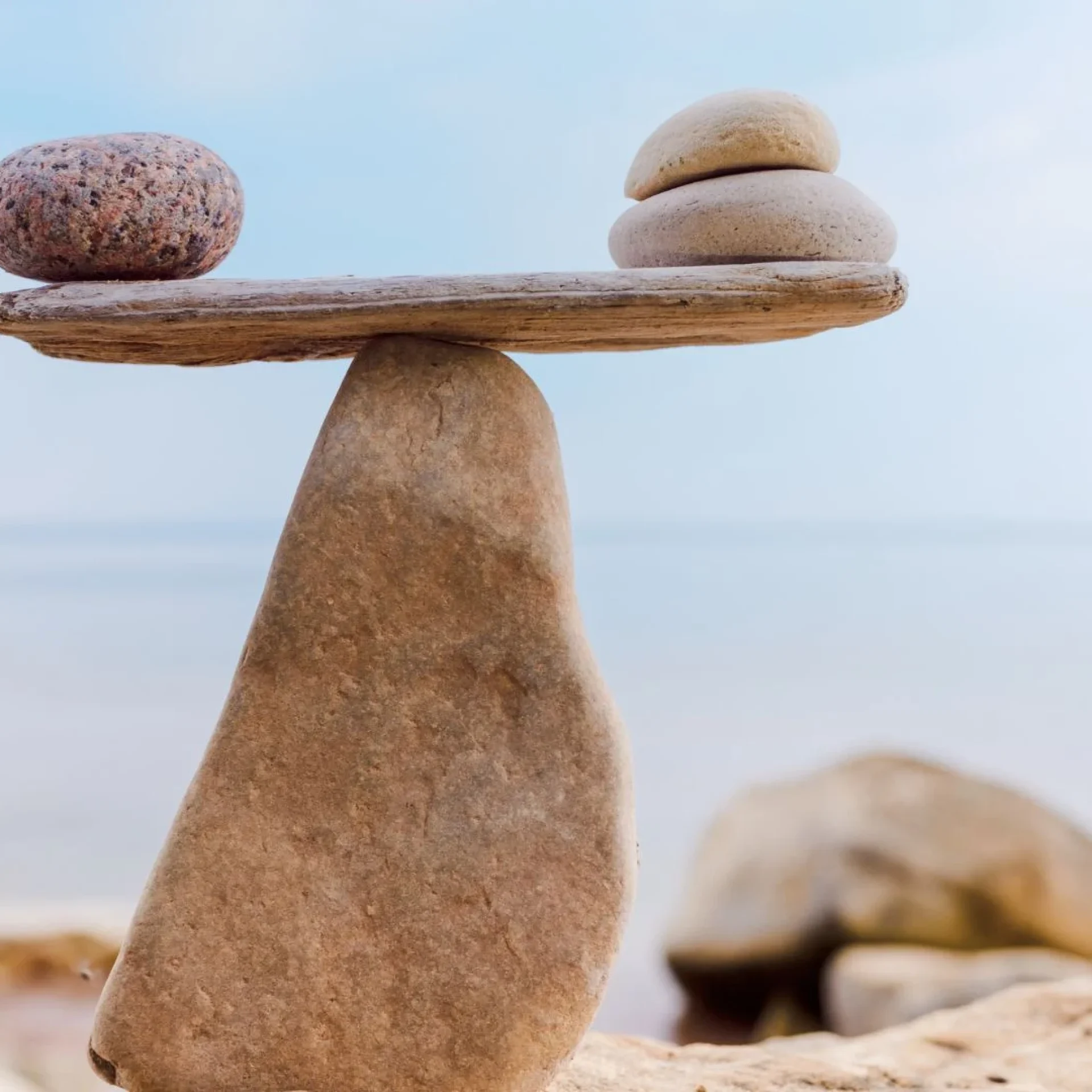 Balanced stones symbolizing women leadership balance and sustainable success