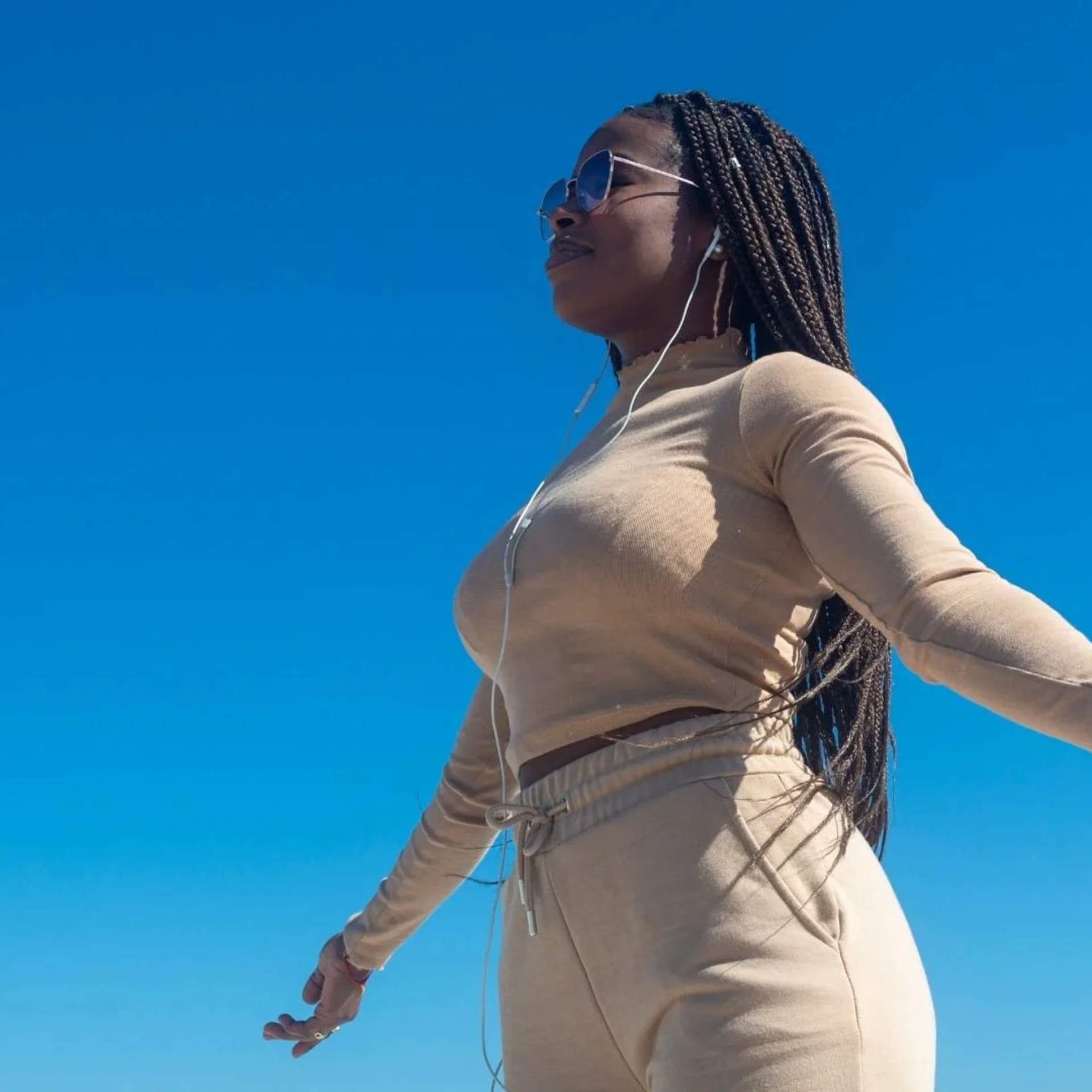 empowered-woman-self-control-anger-management.jpg Confident young woman standing strong and composed, symbolizing empowerment through emotional self-control and withheld anger